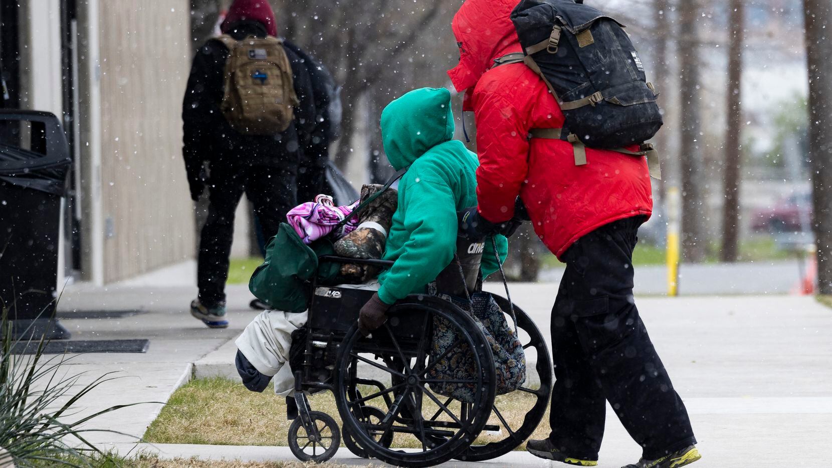 People made their way to Austin Street Center for warmth as snow fell Thursday, Dec. 22,...