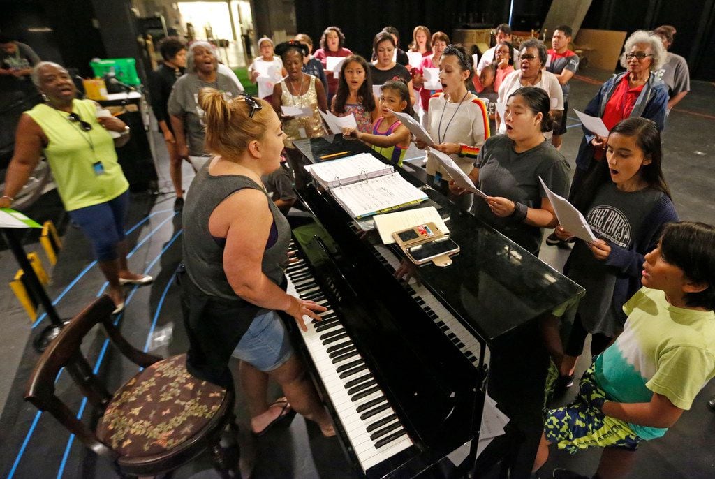 Vonda Bowling, at the keyboard, helps singers rehearse during an Aug. 4 rehearsal for Public...