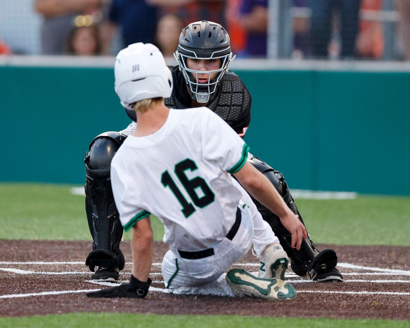 Rockwall catcher Jake Overstreet (11) tags out Waxahachie’s Chris Hill (16) during a Class...
