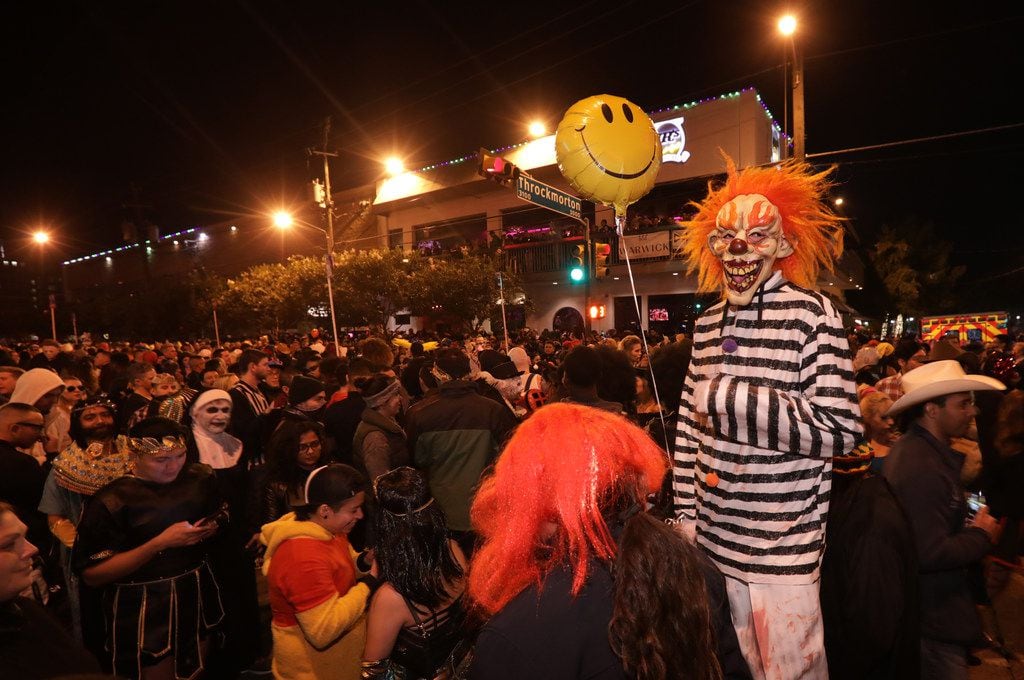 Partygoers enjoy the festivities during the Oak Lawn Halloween Block Party in Dallas, TX, on...
