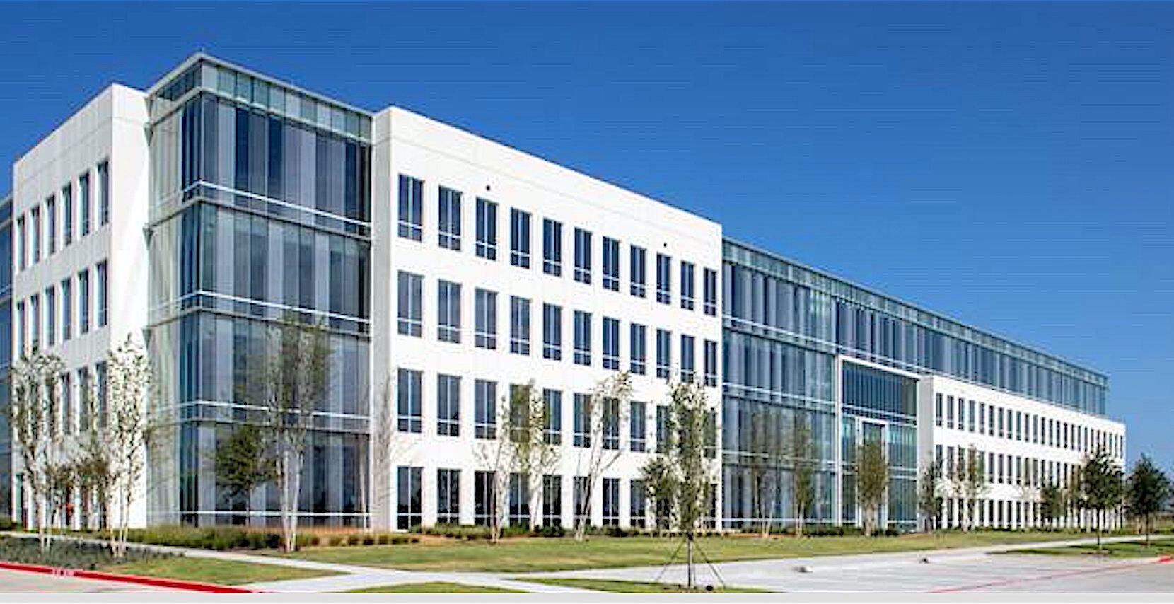 The new office building is near the northwest corner of the Dallas North Tollway and Bush...