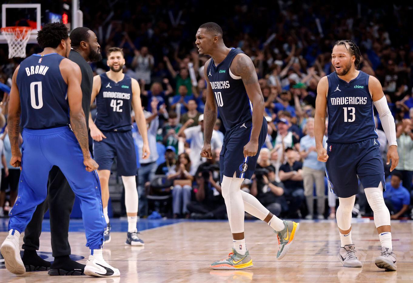 Dallas Mavericks forward Dorian Finney-Smith (10) is firred up after he hit a fourth quarter...