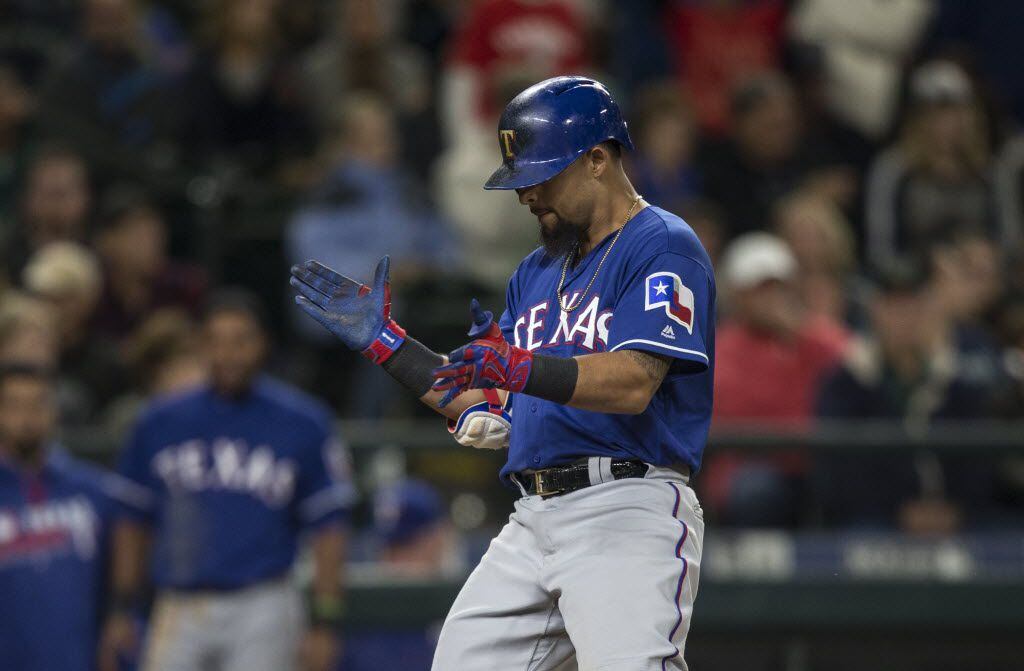 SEATTLE, WA - JUNE 11: Rougned Odor #12 of the Texas Rangers celebrates hitting a solo home...