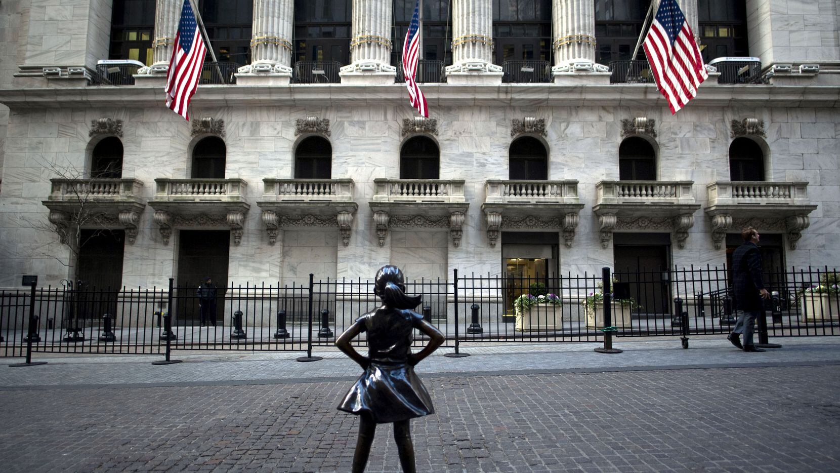 The "Fearless Girl" statue stands facing the New York Stock Exchange in this January file...