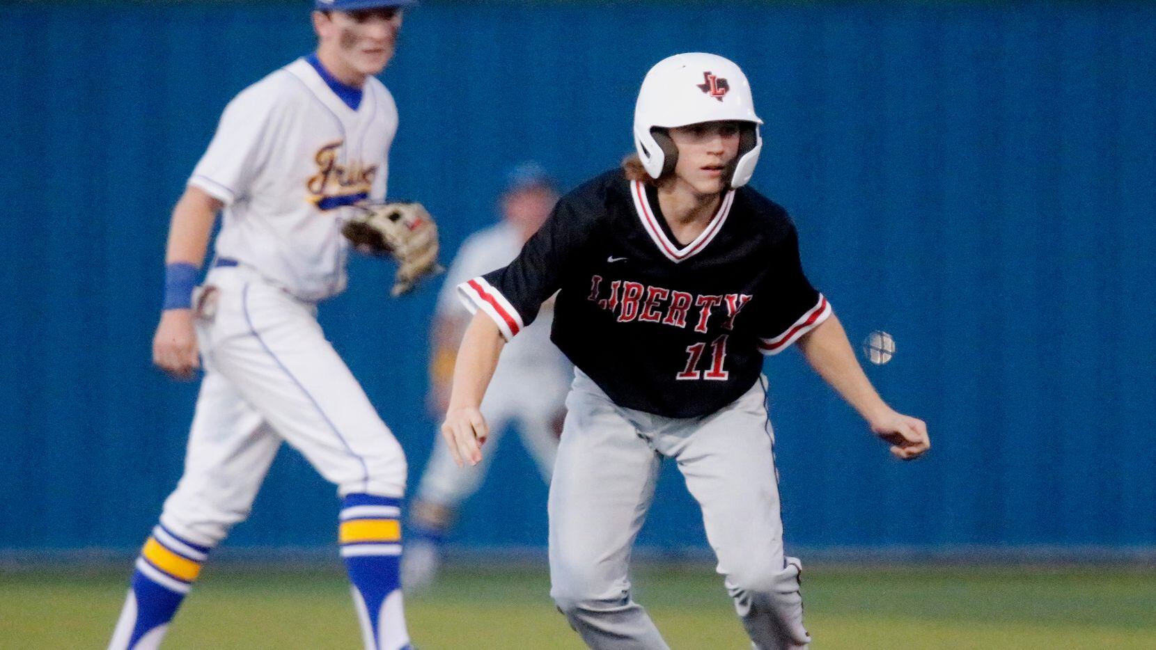 Liberty pinch runner Caden Wartluft (11) runs the base path on his way to third base in the...