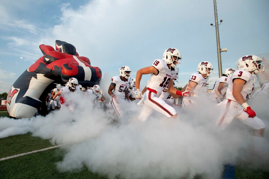 McKinney Boyd senior wide receiver Jack Hagan (19) takes the field with his team before a...