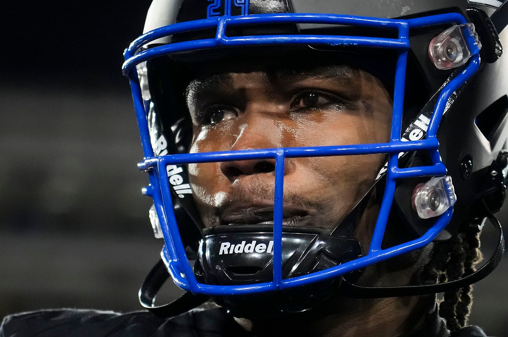 Tears stream down his cheeks as SMU wide receiver Rashee Rice looks out over the stadium...