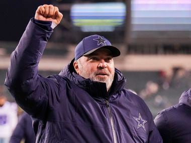 Dallas Cowboys head coach Mike McCarthy pumps his fist to the crowd as he leaves the field after a 51-26 victory over the Philadelphia Eagles in an NFL football game at Lincoln Financial Field on Saturday, Jan. 8, 2022.