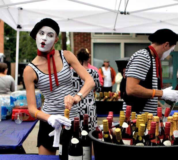 Wine pourers get into the spirit of Bastille on Bishop on July 14, 2013 on Bishop Ave. in...