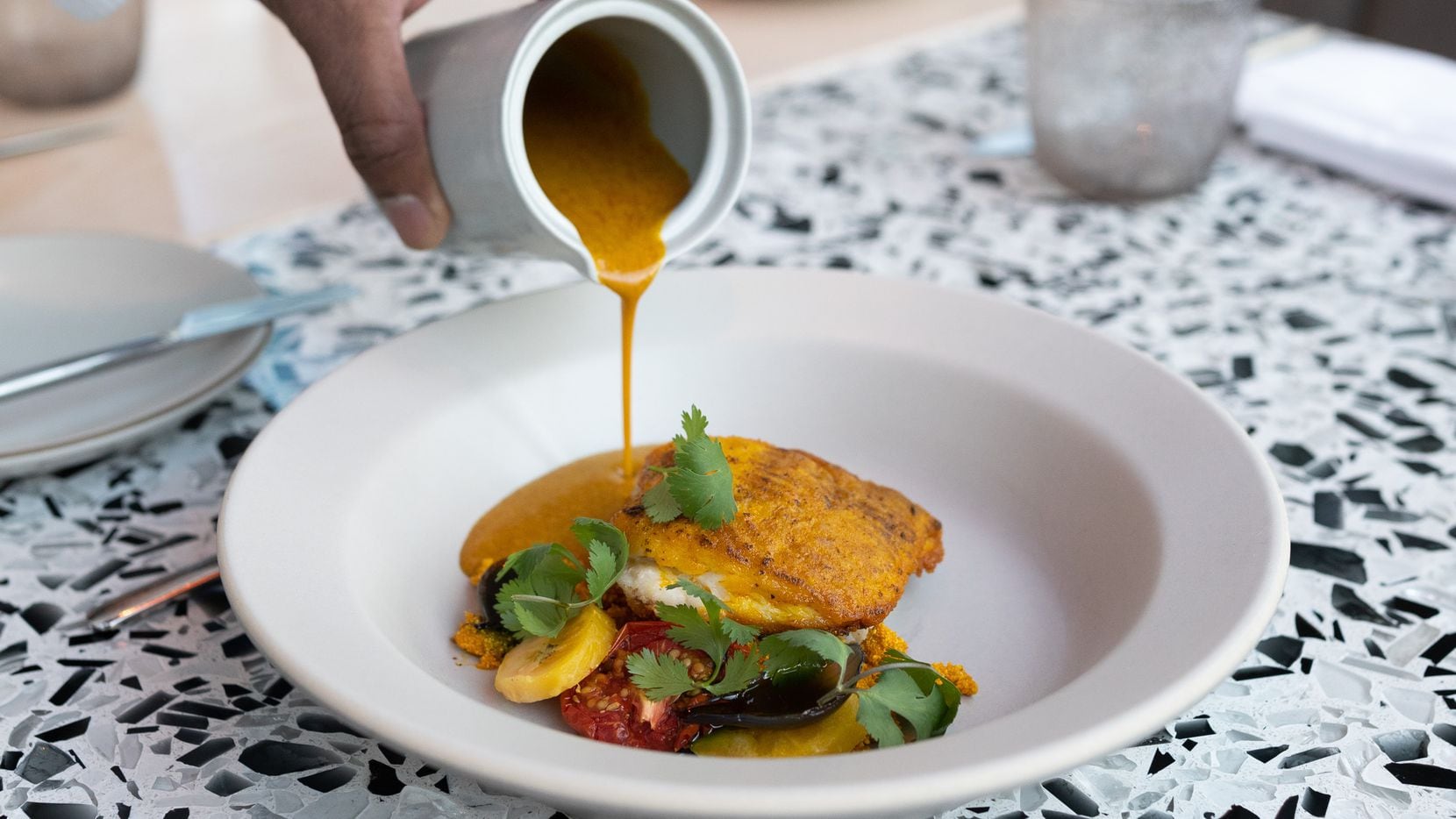 Skate moqueca, charred plantain, coconut broth and steamed rice at the restaurant Meridian.