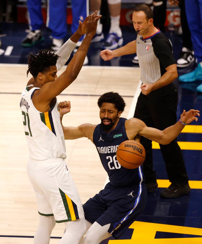 Dallas Mavericks guard Spencer Dinwiddie (26) falls back after Utah Jazz center Hassan...