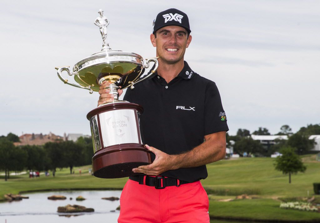 Billy Horschel poses for a photo with his trophy after he won the tournament in a playoff in...