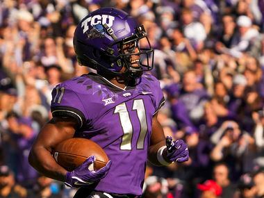 TCU wide receiver Derius Davis (11) races downfield on an 82-yard punt return for a...