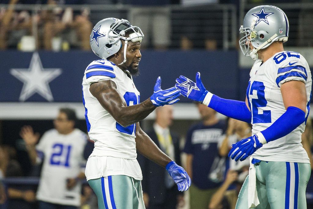Dallas Cowboys wide receiver Dez Bryant (88) shakes hands with tight end Jason Witten (82)...