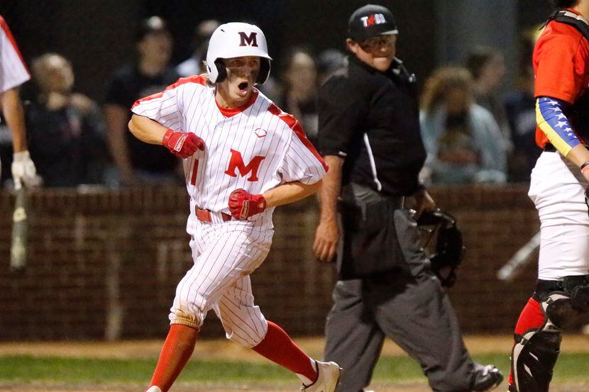 Flower Mound Marcus' Nick Mazzola scores a run in the first inning during Marcus' 6-4...