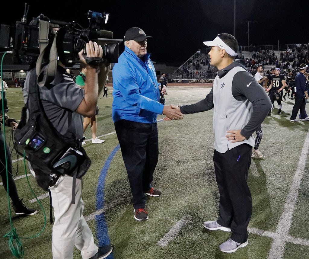 Lone Star High School head coach Jeff Rayburn (right shakes hands with sportscaster Dale...
