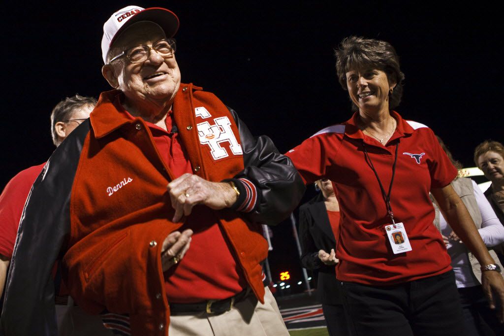 Raymond Dennis, 88, is honored with a letterman's jacket presented to him by administrator Gina Farmer and his family during the Cedar Hill School Homecoming football game on September 30, 2011. (Patrick T. Fallon/The Dallas Morning News)