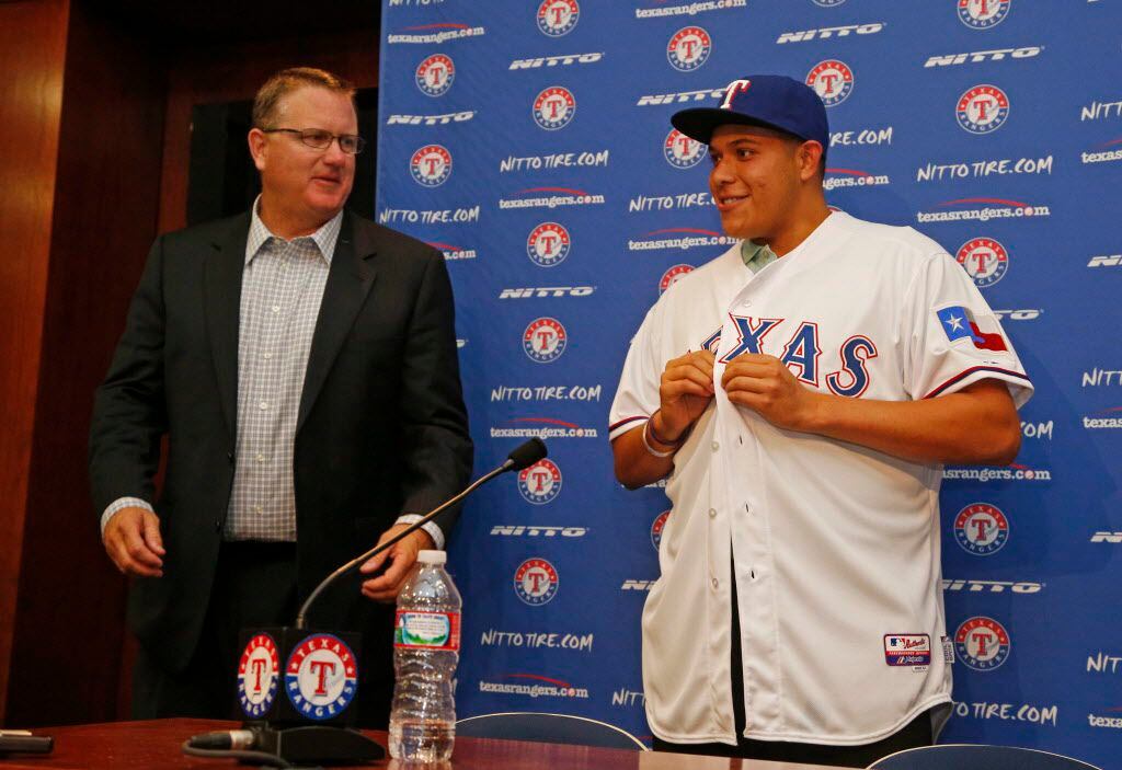 Kip Fagg, left, of the Texas Rangers introduces first round draft pick Luis Ortiz, at Globe...