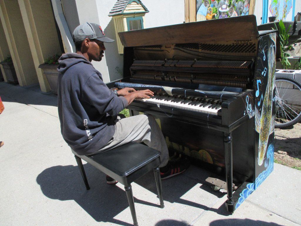 Downtown Mobile is a music hotspot. Here, a musician named Keith plays at a piano by the...