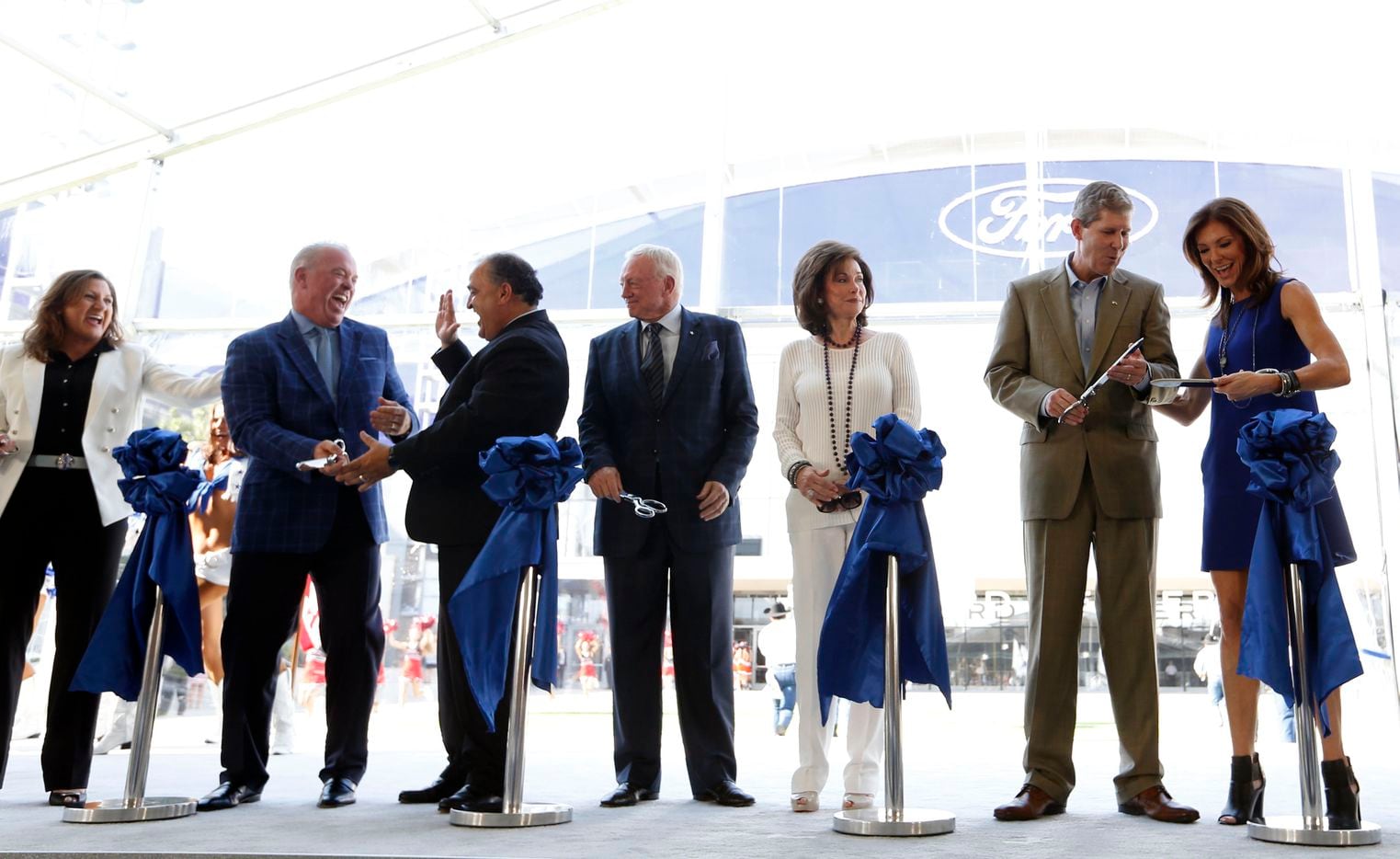 Representatives from Ford, the Dallas Cowboys, the city of Frisco and Frisco ISD celebrate after cutting the ribbon at a ceremony at the Dallas Cowboys new headquarters at The Star in Frisco on Sunday, Aug. 21, 2016. 