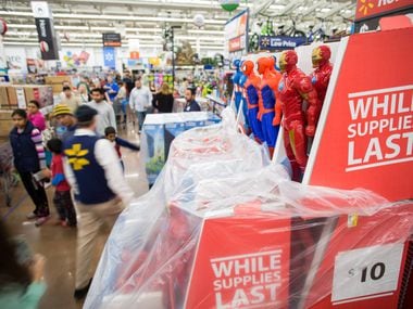 A scene from the retro days of Black Friday at a Walmart. That message of "while supplies last" is a theme for holiday 2021.