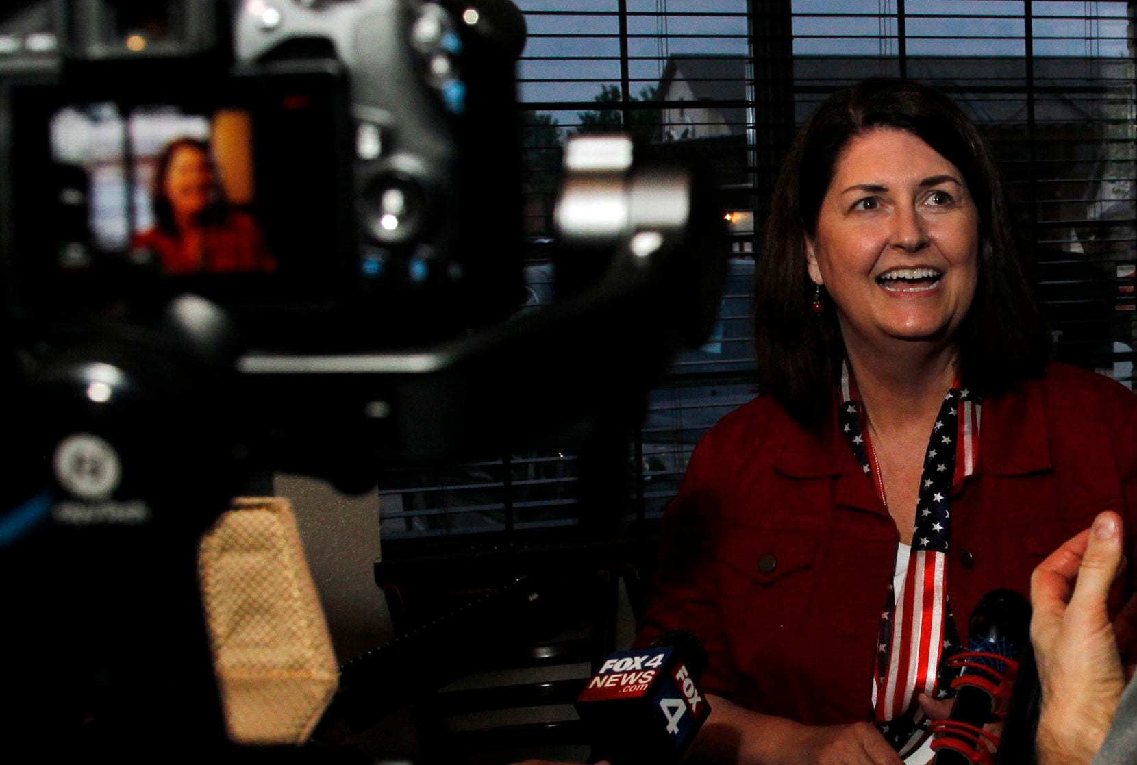 Susan Wright, candidate for Congress in District 6, converses with reporters during a brief...
