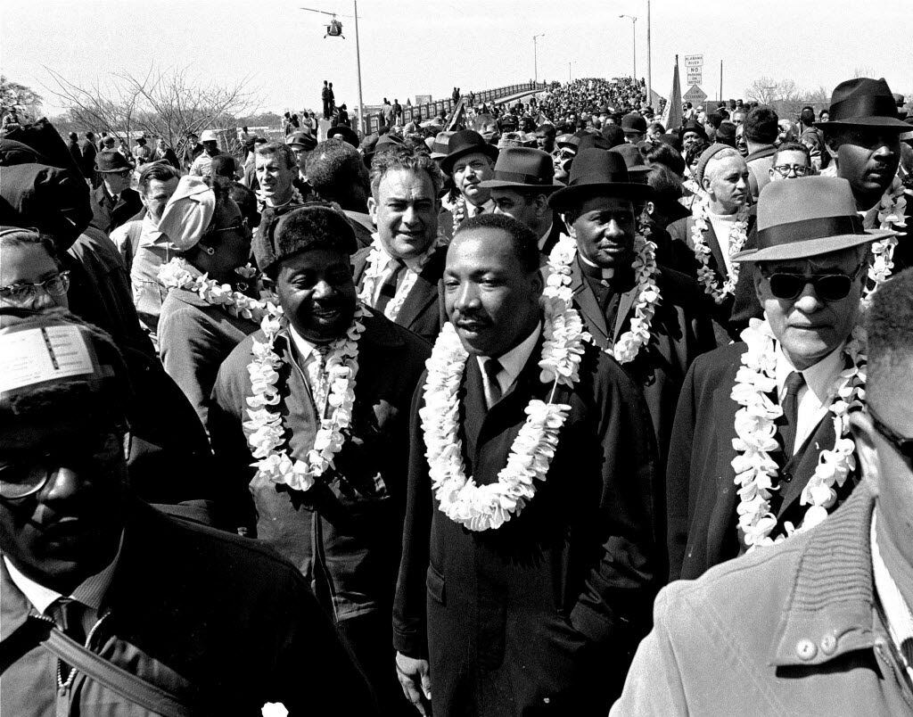 FILE - In this March 21, 1965 file photo, Martin Luther King, Jr. and his civil rights...