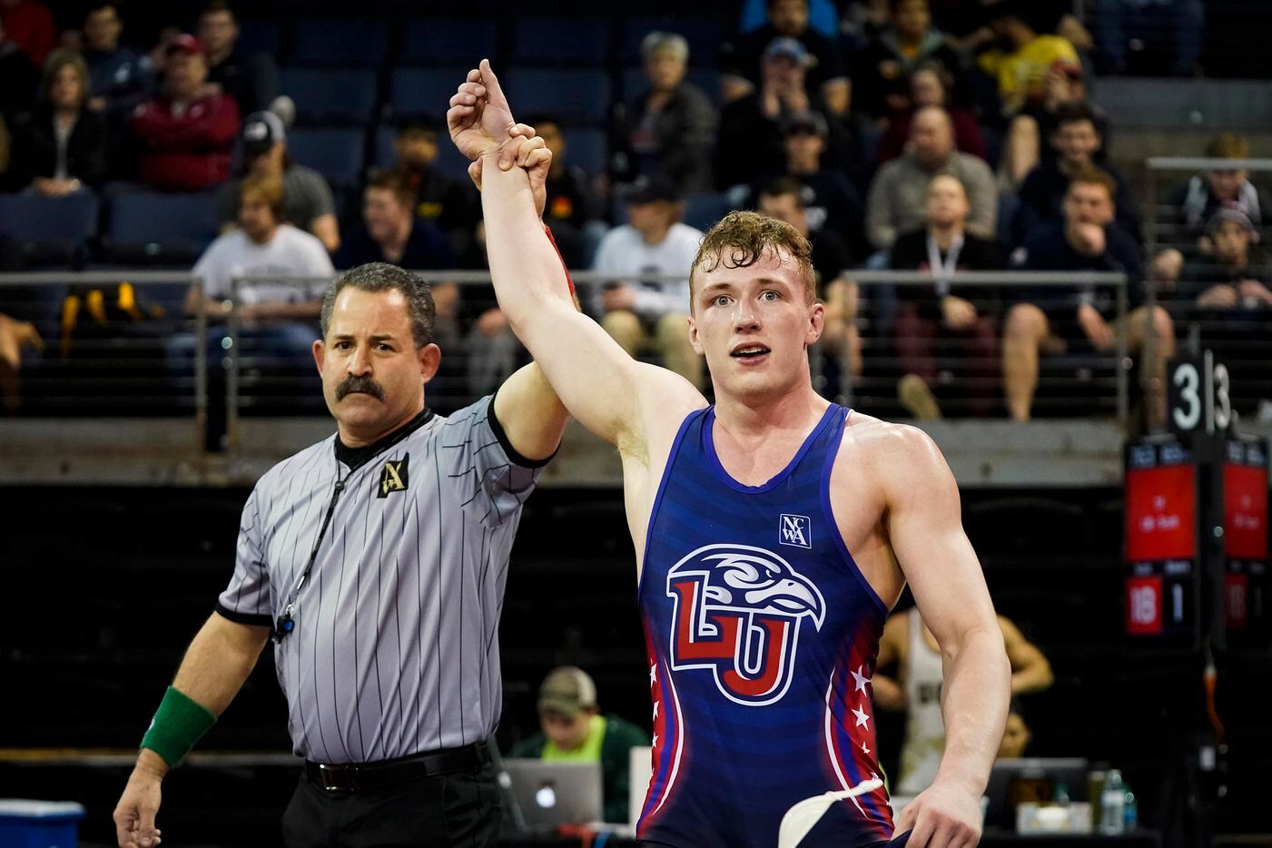Joe Scott of Liberty University is acknowledges as the winner after defeating Desmond Bowers...