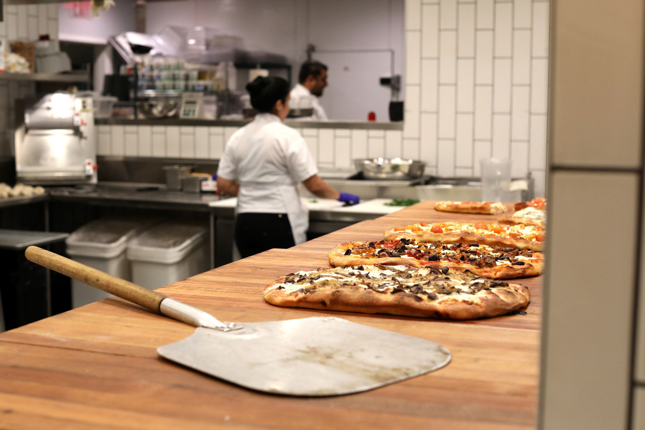 Pizzas are ready to be cut at Darna in Plano.