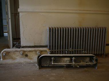 Old fountains and a radiator in the historic Davy Crockett School, which is being converted...