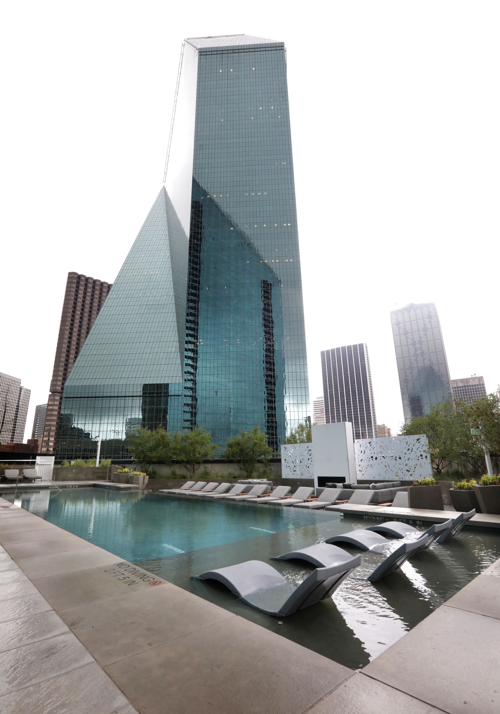 The pool at Amli Fountain Place gives a closeup view of the original skyscraper next door.