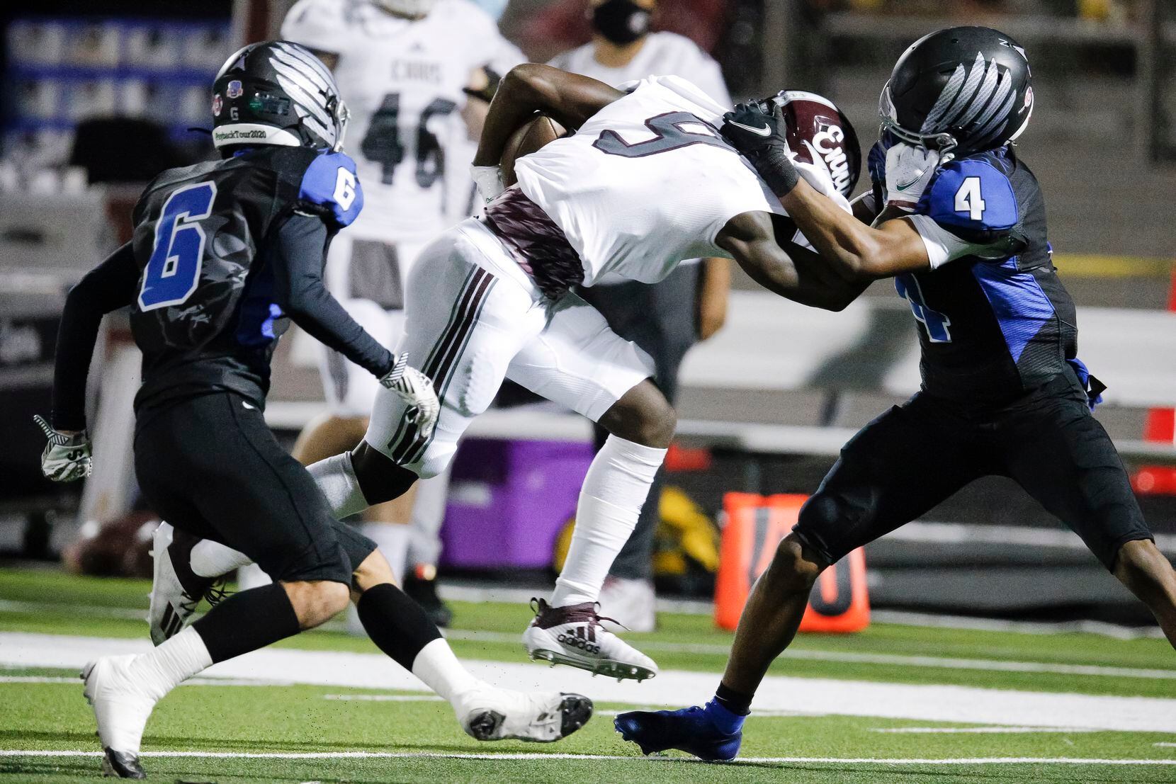 Ennis junior wide receiver Devion Beasley (9) battles North Forney senior defensive back Emarlyee Stewart (4) for space during the first half of a high school playoff football game in Forney, Thursday, November 19, 2020. (Brandon Wade/Special Contributor)