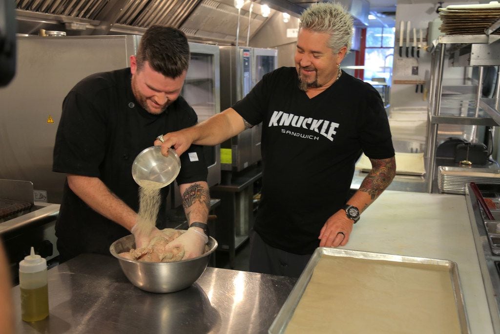 Diners, Drive-Ins and Dives host Guy Fieri cooks with Jeremy Scott, chef and owner of...