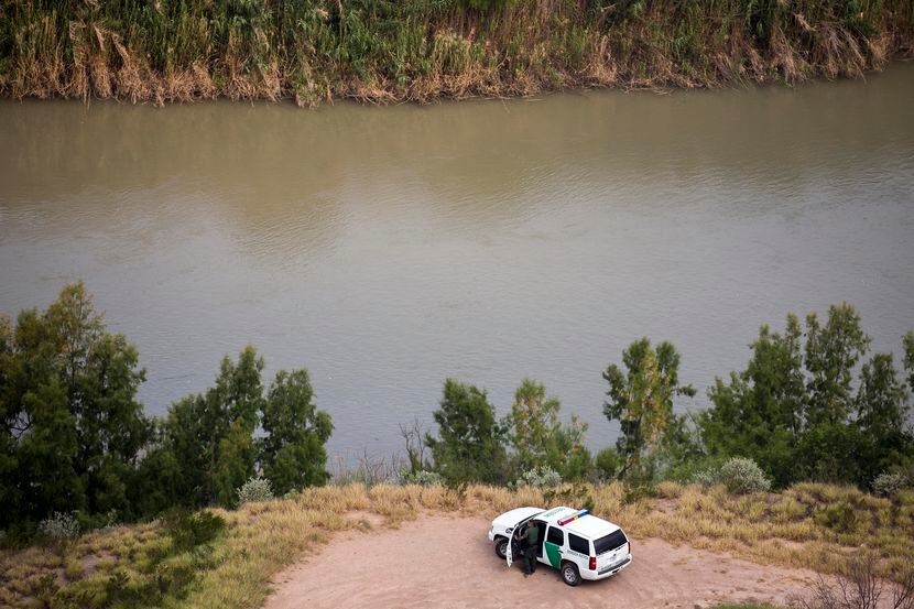 A U.S. Customs and Border Protection officer watches over the Rio Grande River on Wednesday,...