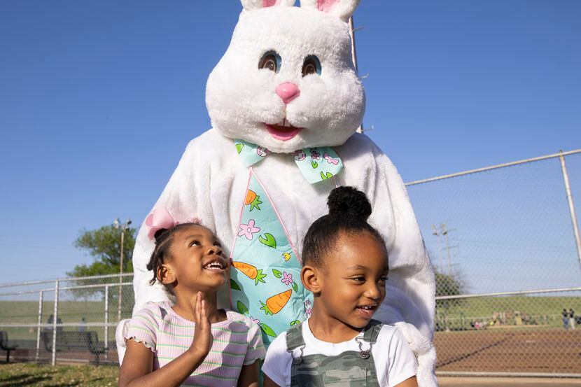 Piper Deadmon, 4, and Hollis Ward, 4, pose for a photo with the Easter bunny at Dallas Park...