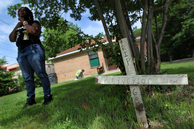 Linda Bates, left, waits in the front yard of her West Dallas home as Trey Brown of UT...