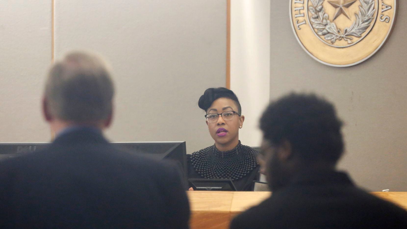 Judge Amber Givens-Davis listens as defense attornery Paul Johnson (left) speaks as Thomas Johnson (right) listens during the second day of his murder trial at Frank Crowley Courts Building in Dallas on Tuesday, April 30, 2019. Johnson is accused of killing Dave Stevens, 53, who was on his daily run along White Rock Creek Trail back on October 12, 2015. (Vernon Bryant/The Dallas Morning News)