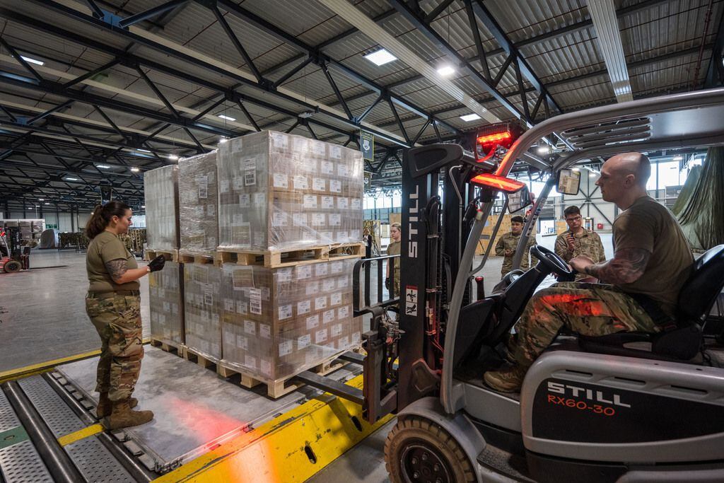 U.S. soldiers loaded pallets with baby formula at Ramstein American Air Force base on...