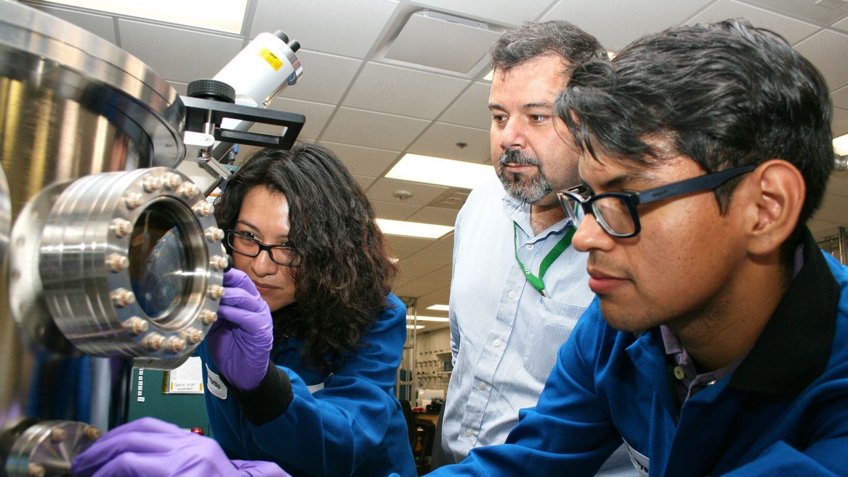 Dr. Manuel Quevedo-Lopez works in his UT Dallas lab with former students. The researchers...