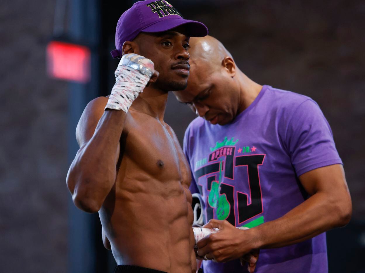 Errol Spence Jr. gets his hands unwrapped during the Texas Live! Media Workout, Wednesday,...