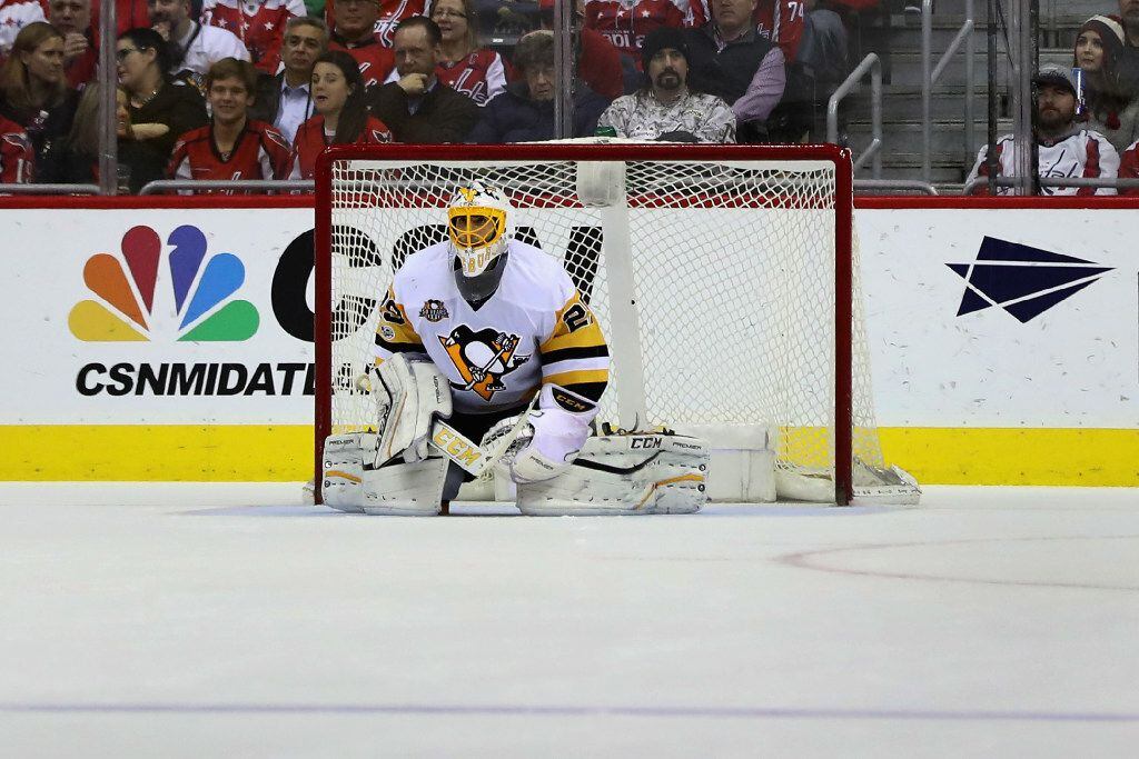 WASHINGTON, DC - JANUARY 11: Goalie Marc-Andre Fleury #29 of the Pittsburgh Penguins follows...