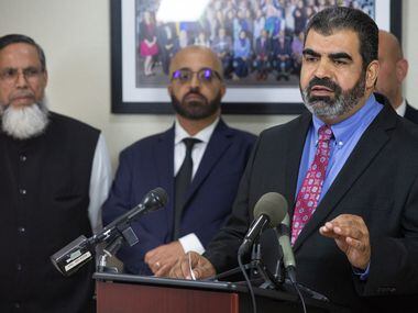 Muslim community leader Abderraoof Alkhawaldeh (right) spoke  during a press conference at the Council on American-Islamic Relations office in Dallas on Thursday. Alkhawaldeh and another Muslim community leader, Issam Abdallah (second from left), said they were profiled and discriminated against during a recent American Airlines flight in Alabama.

