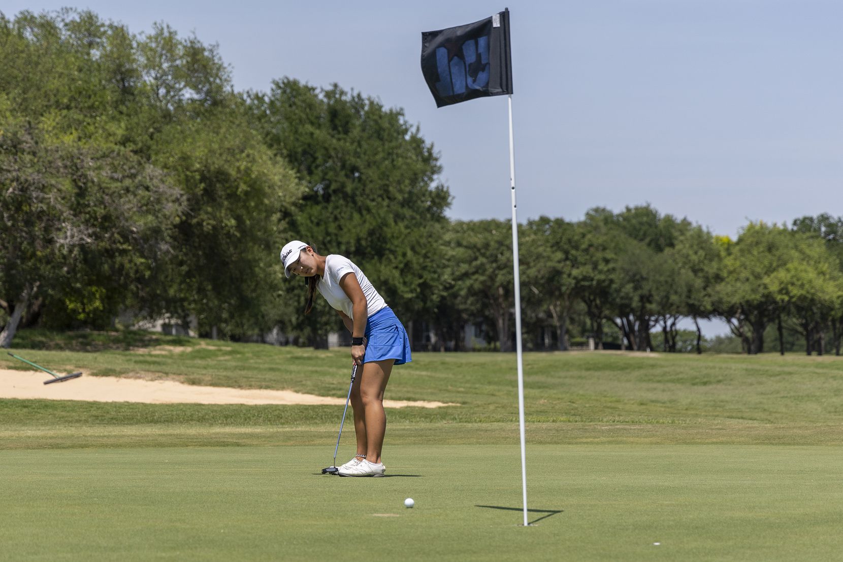 Hebron’s Estelle Seon putts on the 18th green during the 6A girls state golf tournament in...