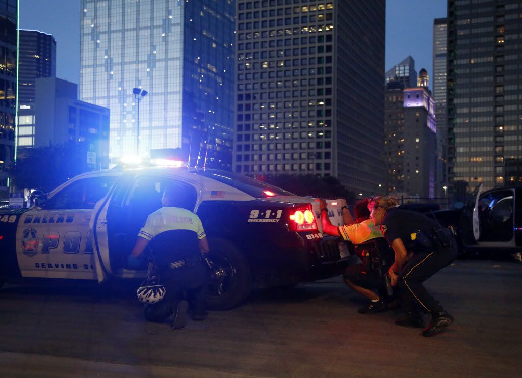 Dallas Police respond after shots were fired at a Black Lives Matter rally in downtown Dallas on Thursday, July 7, 2016. Dallas protestors rallied in the aftermath of the killing of Alton Sterling by police officers in Baton Rouge, La. and Philando Castile, who was killed by police less than 48 hours later in Minnesota. (G.J. McCarthy/The Dallas Morning News) -- MANDATORY CREDIT, NO SALES, MAGS OUT, TV OUT, INTERNET USE BY AP MEMBERS ONLY