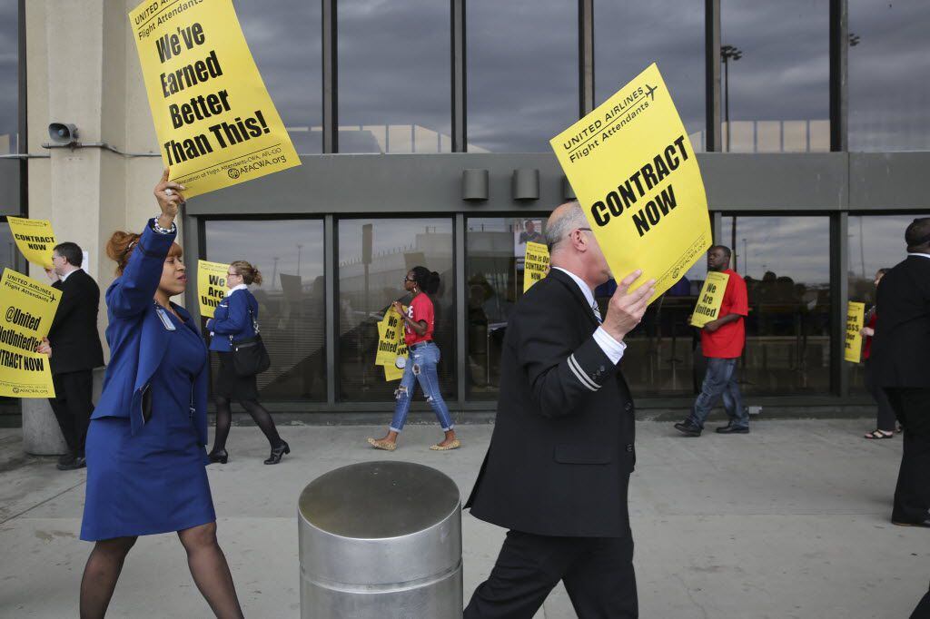 United Airlines employees picketed outside Newark Liberty International Airport in Newark,...