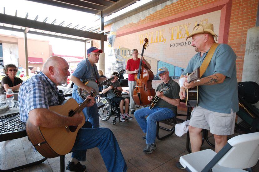 Musicians perform during Bluegrass on Ballard in downtown Wylie.