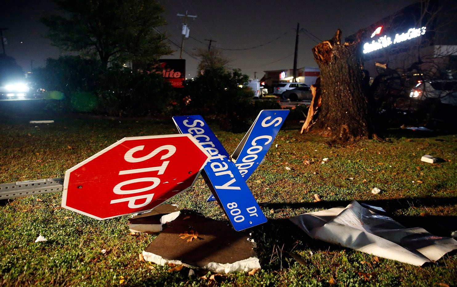 The street sign on Cooper St. at Secretary Dr. was blown over in Arlington when a tornado-warned storm blew through, Tuesday night, November 24, 2020. No one was seriously injured across the street at the Burger Box restaurant.