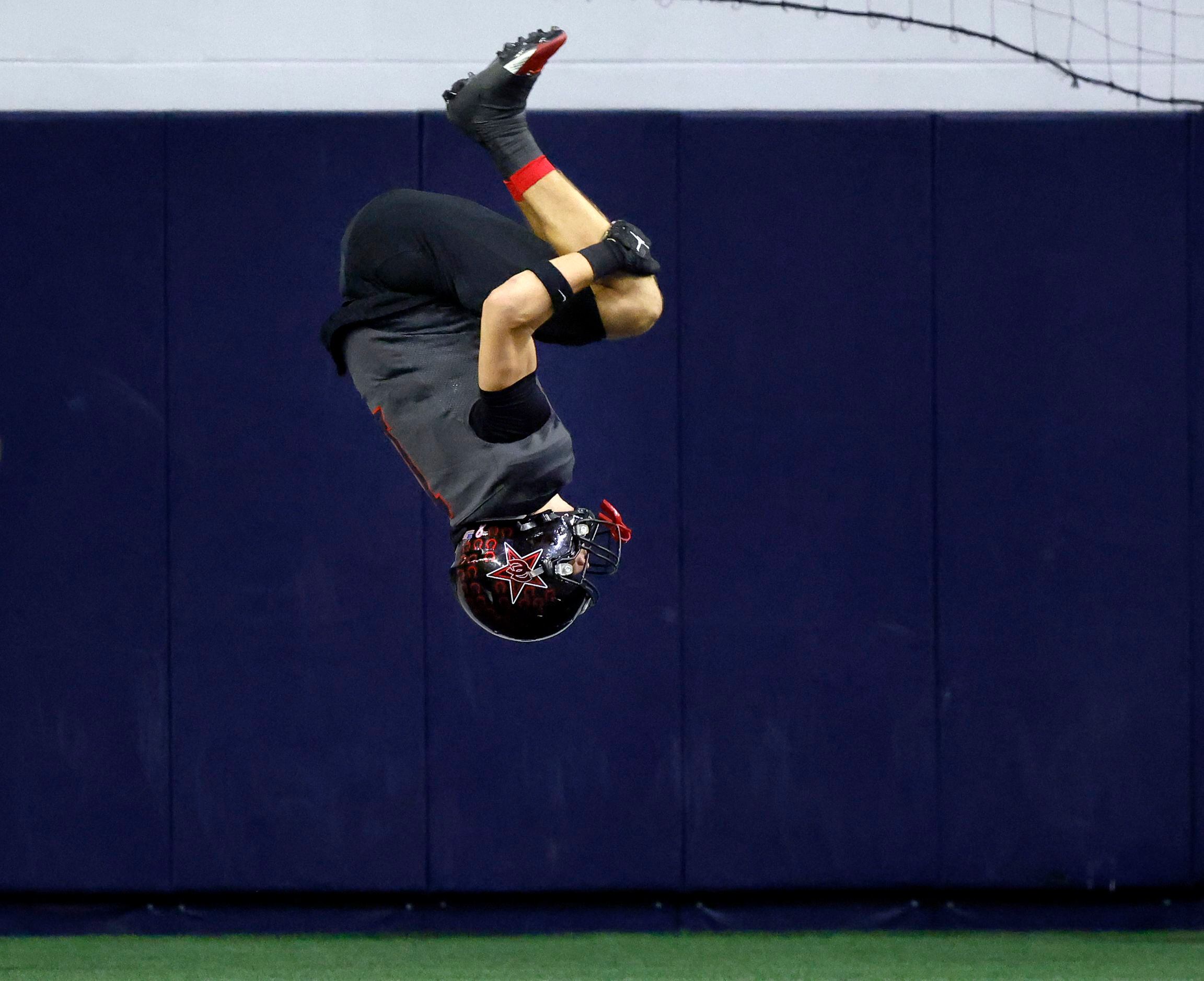 Coppell wide receiver Baron Tipton (1) does a flip in the end zone after scoring with a long...