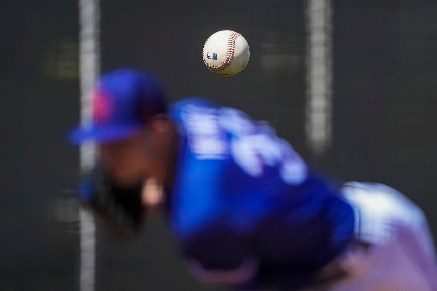 Texas Rangers pitcher John King throws live batting practice during a spring training...
