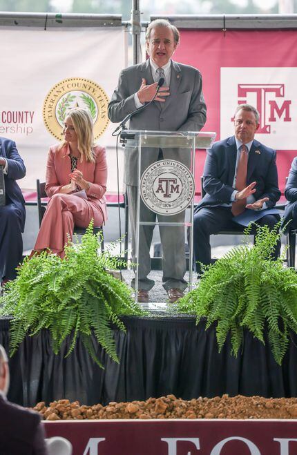 The crowd and officials behind John Sharp (center), chancellor of Texas A&M University...